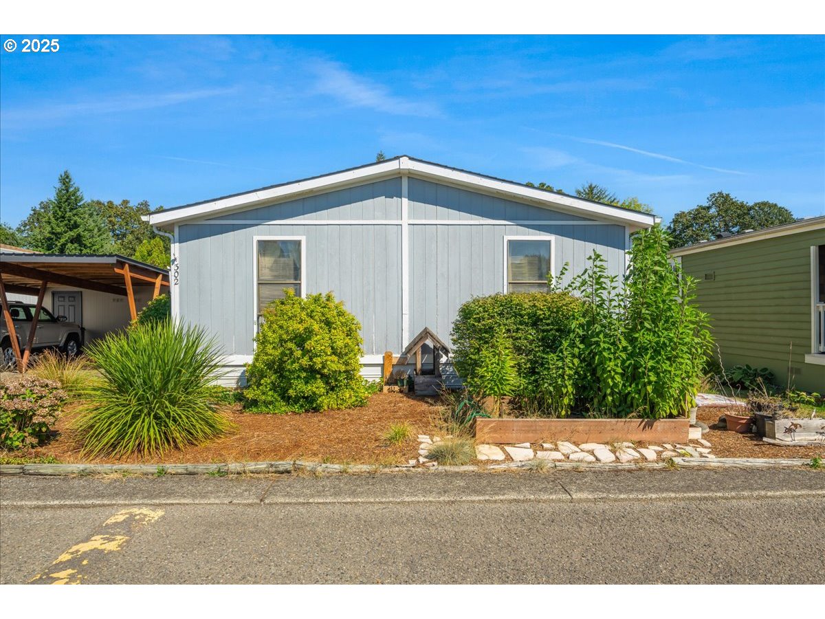 300 Southwest 7th Avenue, Unit 302 Battle Ground, WA 98604 - Photo 1 of 41 a view of a house with a yard