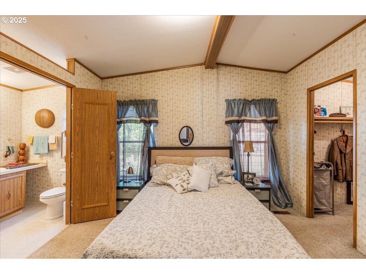 300 Southwest 7th Avenue, Unit 302 Battle Ground, WA 98604 - Photo 15 of 41 a bedroom with furniture and a large window