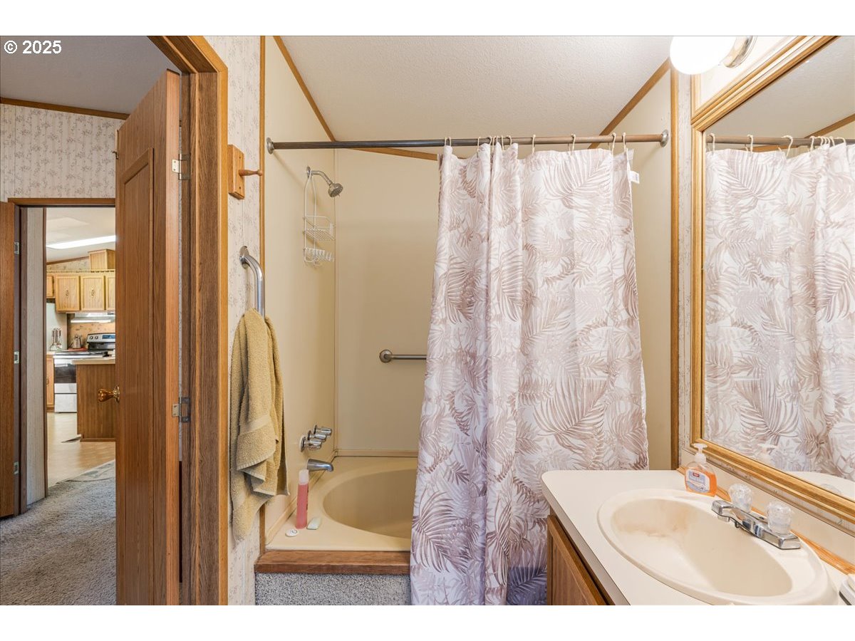 300 Southwest 7th Avenue, Unit 302 Battle Ground, WA 98604 - Photo 19 of 41 a bathroom with a sink and a shower