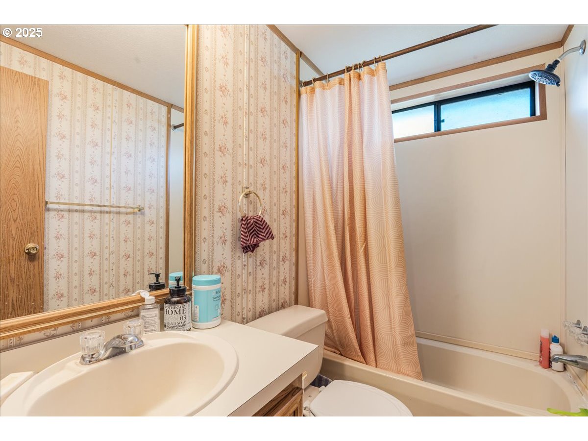300 Southwest 7th Avenue, Unit 302 Battle Ground, WA 98604 - Photo 22 of 41 a bathroom with a sink and a mirror