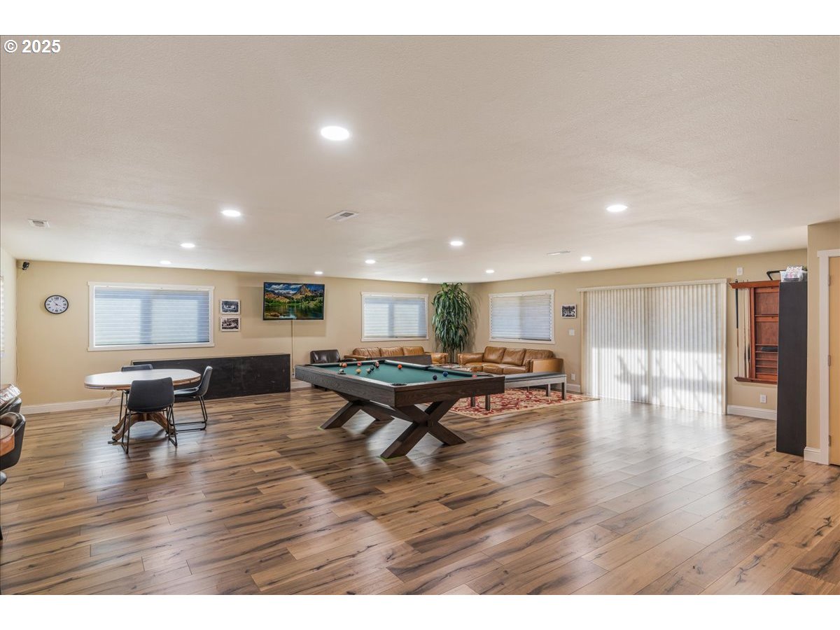 300 Southwest 7th Avenue, Unit 302 Battle Ground, WA 98604 - Photo 35 of 41 a living room with furniture and wooden floor