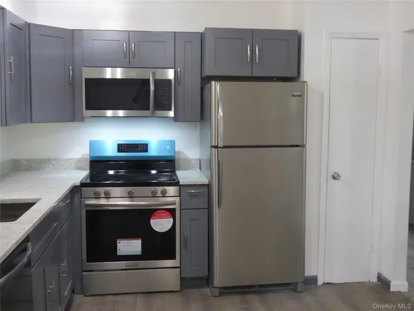 a kitchen with a stove and a microwave