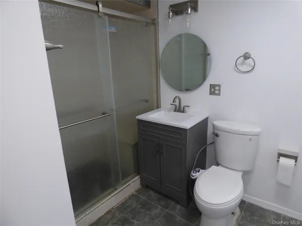 a bathroom with a toilet and a sink