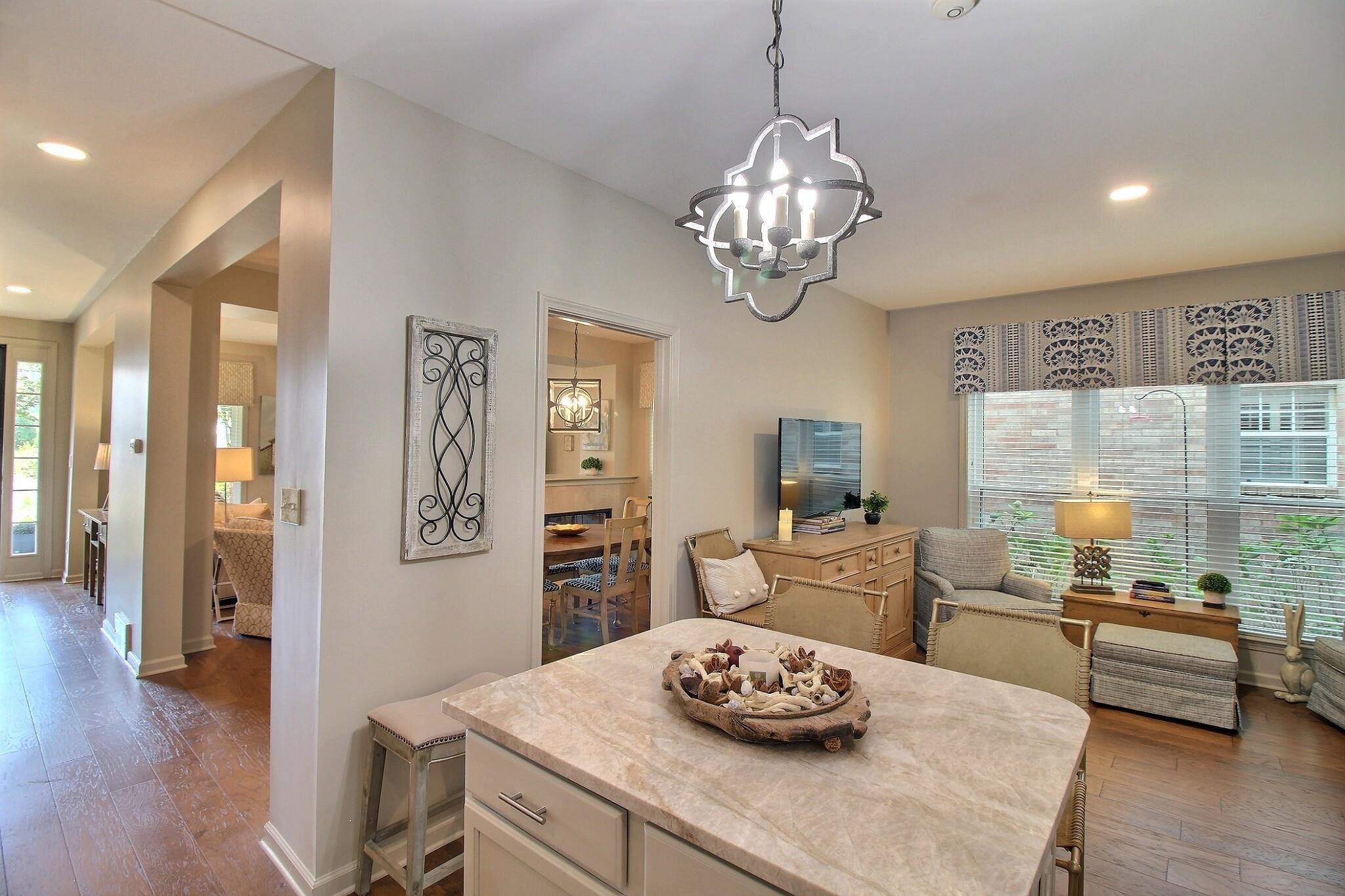4530 Park Ridge Parkway Collierville, TN 38017 - Photo 11 of 27 a view of a dining room with furniture a chandelier and wooden floor