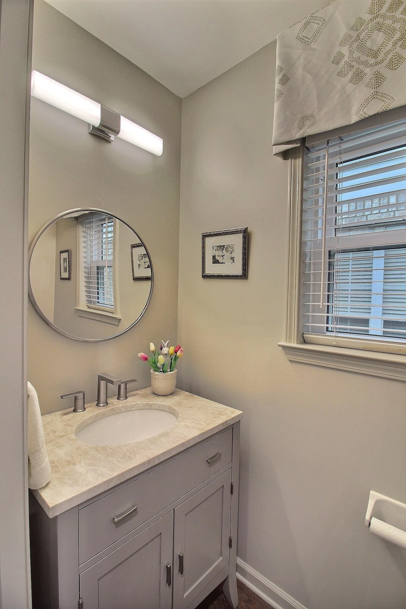 4530 Park Ridge Parkway Collierville, TN 38017 - Photo 12 of 27 a bathroom with a granite countertop sink a mirror and vanity