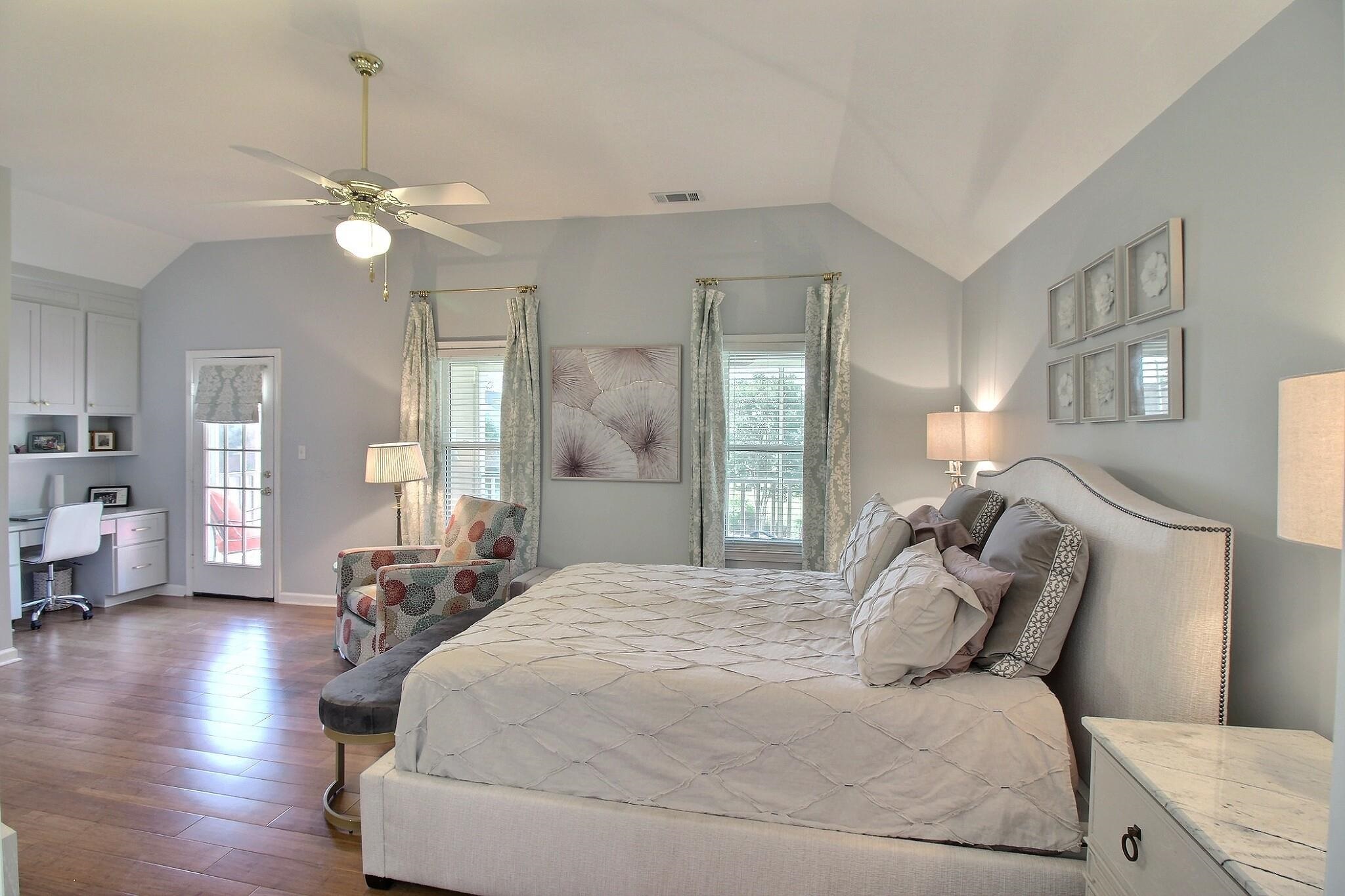 4530 Park Ridge Parkway Collierville, TN 38017 - Photo 15 of 27 a bedroom with a large bed and a chandelier