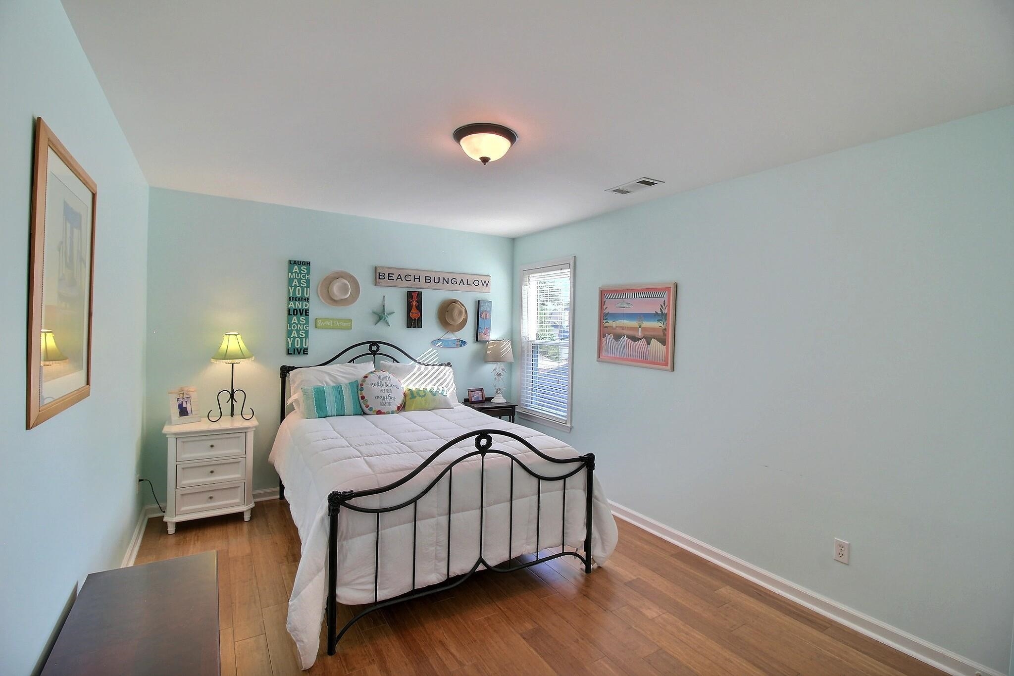 4530 Park Ridge Parkway Collierville, TN 38017 - Photo 20 of 27 a spacious bedroom with a bed and a lamp on table