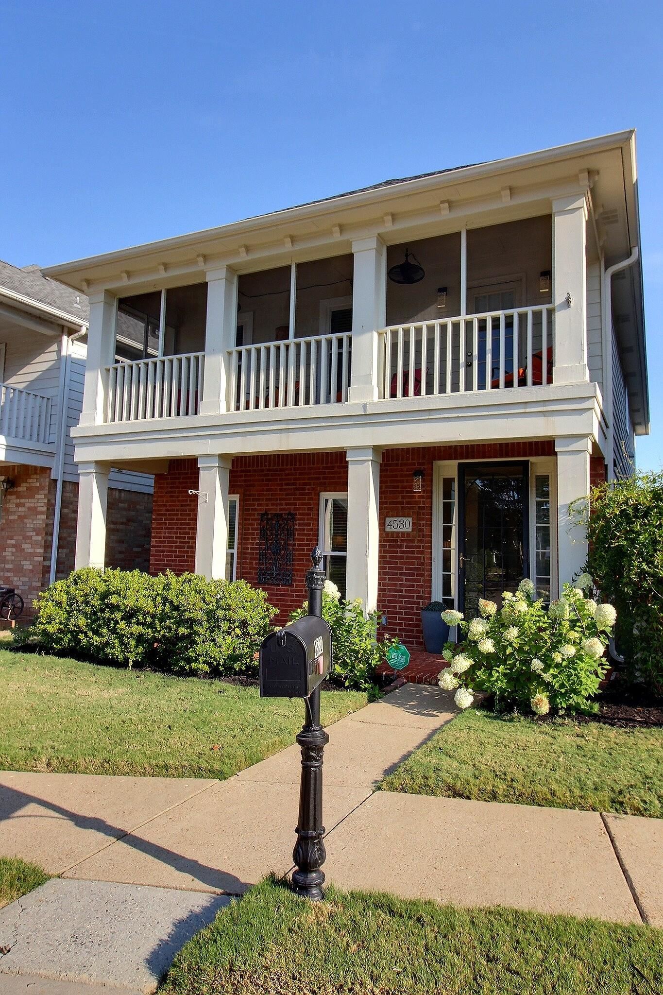 4530 Park Ridge Parkway Collierville, TN 38017 - Photo 2 of 27 a front view of a house with garden and porch
