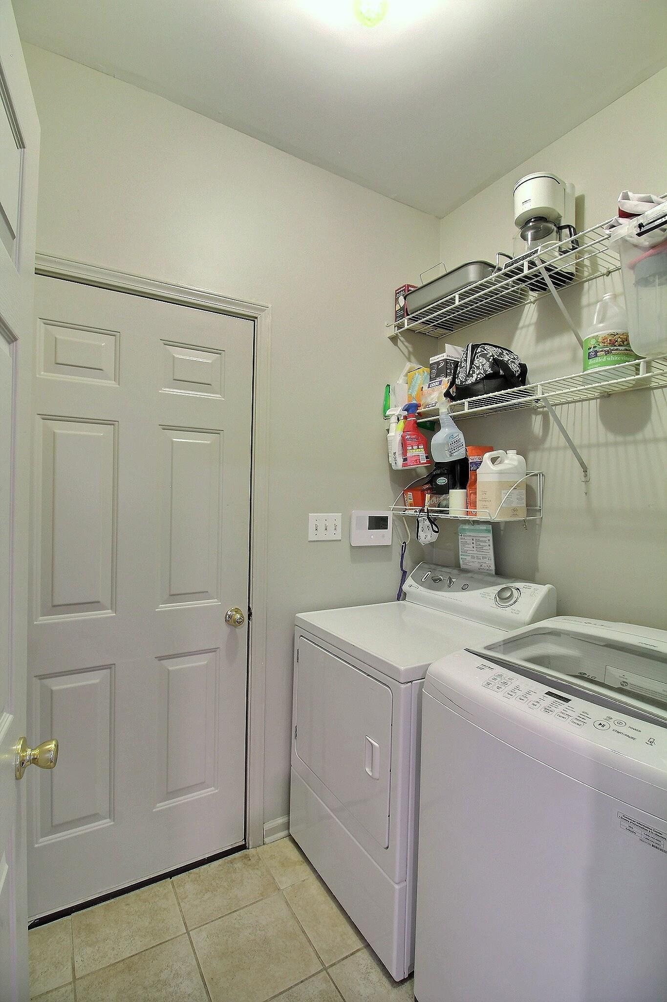 4530 Park Ridge Parkway Collierville, TN 38017 - Photo 23 of 27 a utility room with dryer and washer