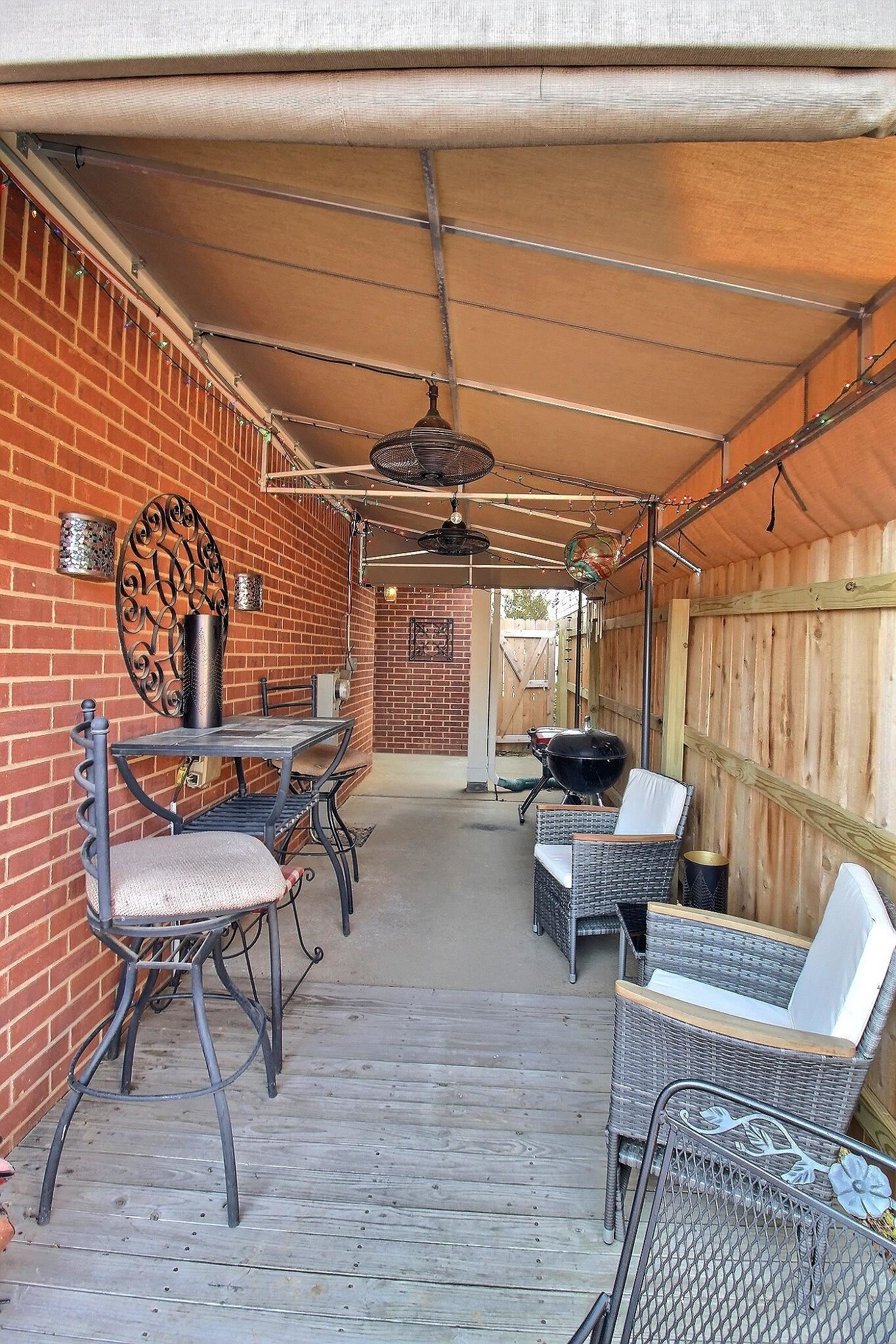 4530 Park Ridge Parkway Collierville, TN 38017 - Photo 26 of 27 a living room with patio furniture and a wooden floor