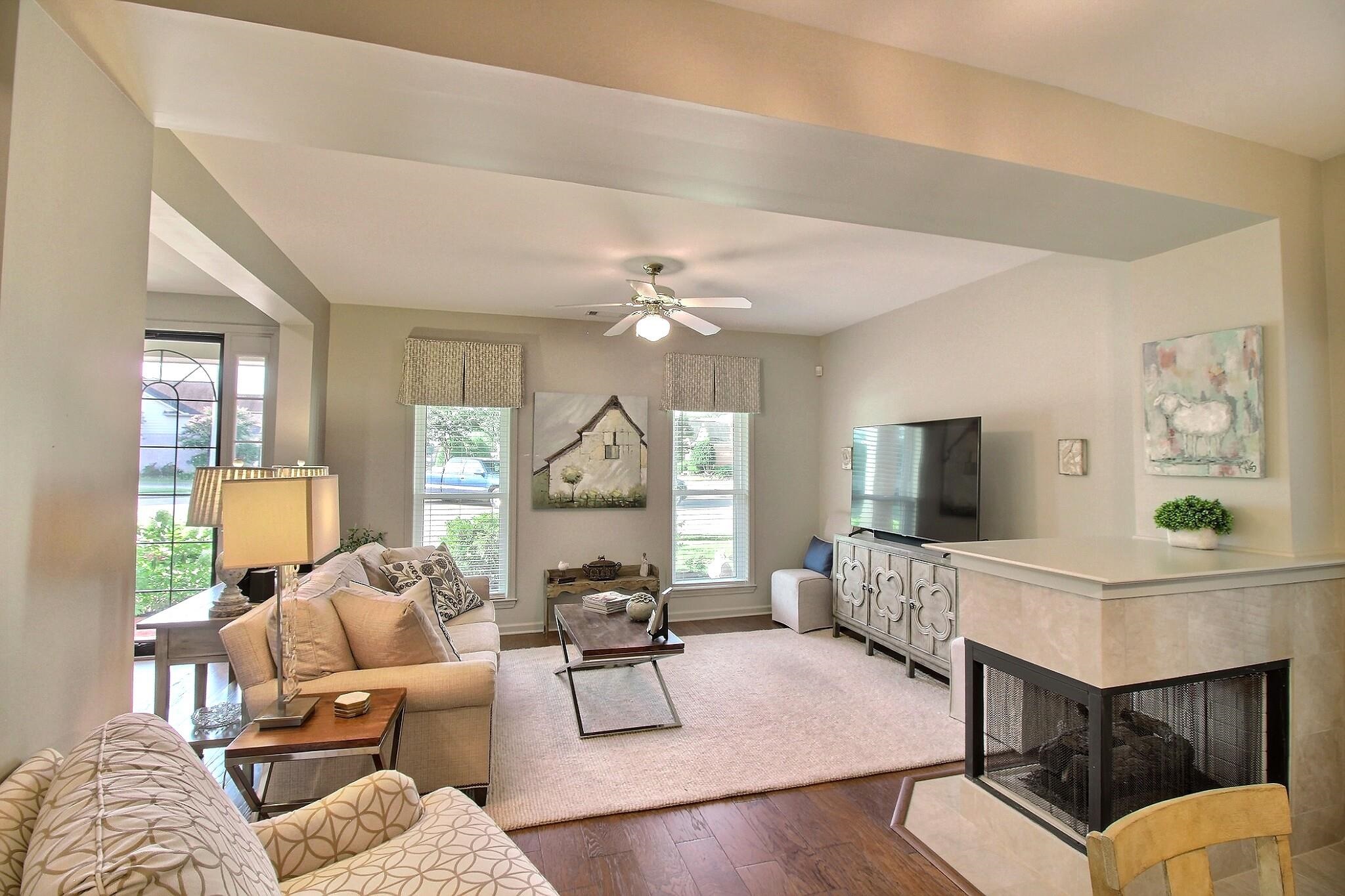 4530 Park Ridge Parkway Collierville, TN 38017 - Photo 3 of 27 a living room with furniture a flat screen tv and a large window