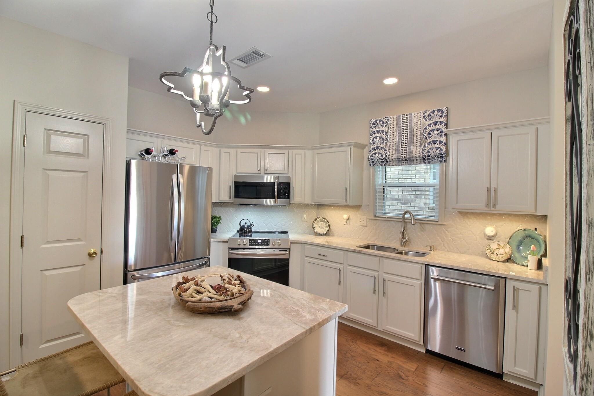 4530 Park Ridge Parkway Collierville, TN 38017 - Photo 9 of 27 a kitchen with stainless steel appliances a sink a stove a refrigerator and white cabinets