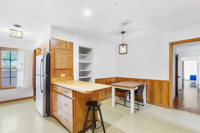 a view of a room with furniture and window