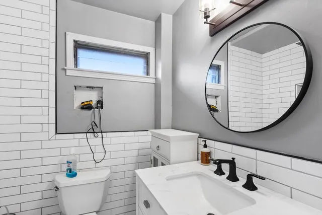 a bathroom with a sink and mirror