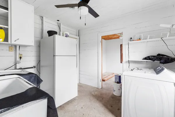a white refrigerator freezer sitting inside of a kitchen