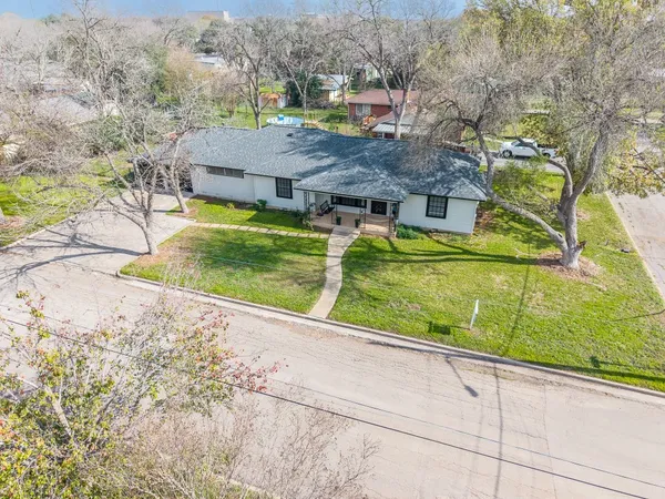 an aerial view of houses with outdoor space