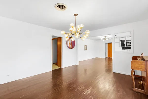 a view of a livingroom with wooden floor