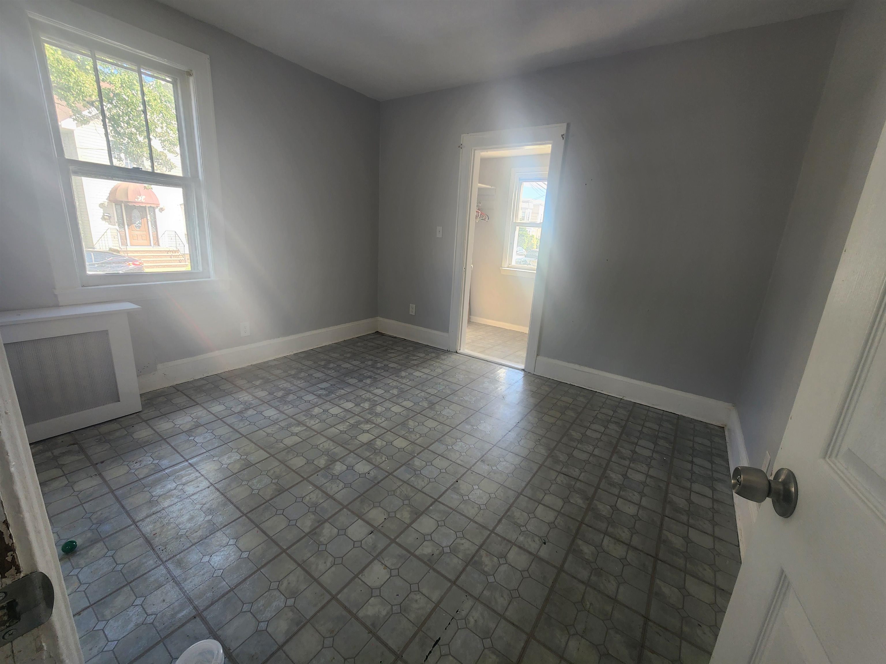 261 Centre Avenue, Unit 1 Secaucus, NJ 07094 - Photo 9 of 11 an empty room with windows