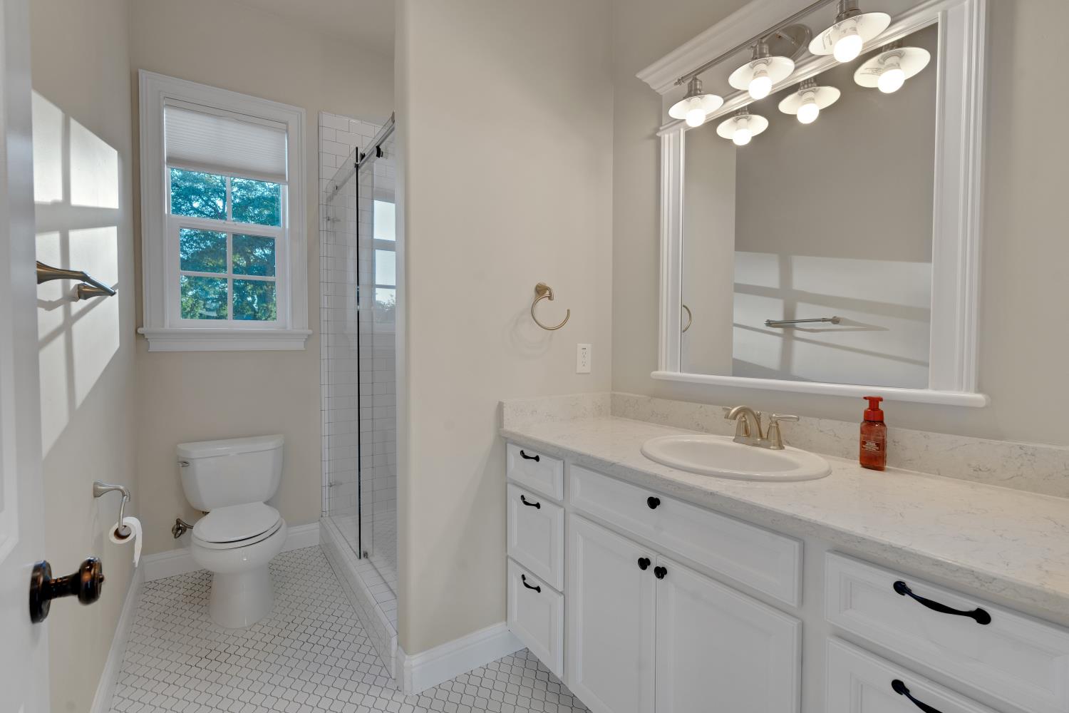2905 Virginiatown Road Lincoln, CA 95648 - Photo 47 of 86 Guest House-Bathroom featuring a white vanity with extensive counter space, an undermount sink, and a coordinating mirror with overhead lighting