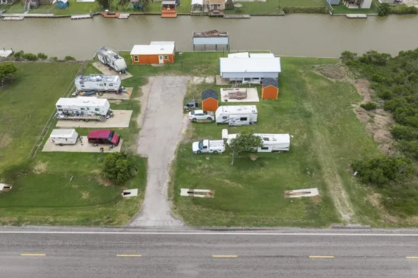 an aerial view of a house with a lake view