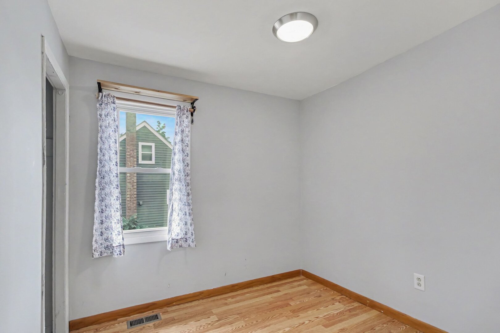 208 West Nippersink Road Round Lake, IL 60073 - Photo 9 of 18 a view of empty room with window