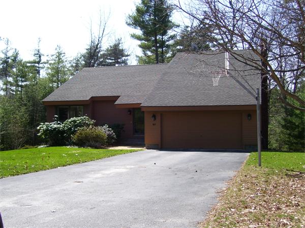 85 Stonefence Road Lunenburg, MA 01462 - Photo 1 of 1 a front view of a house with a yard and garage