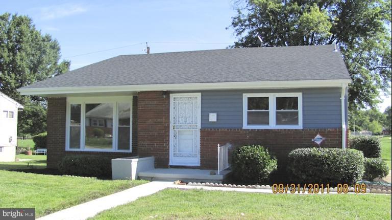 7116 Minna Road Gwynn Oak, MD 21207 - Photo 12 of 12 a front view of a house with a yard