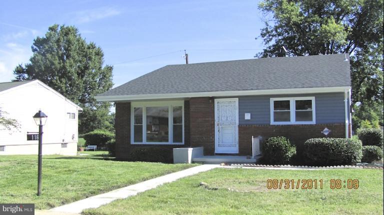7116 Minna Road Gwynn Oak, MD 21207 - Photo 4 of 12 a front view of a house with a yard