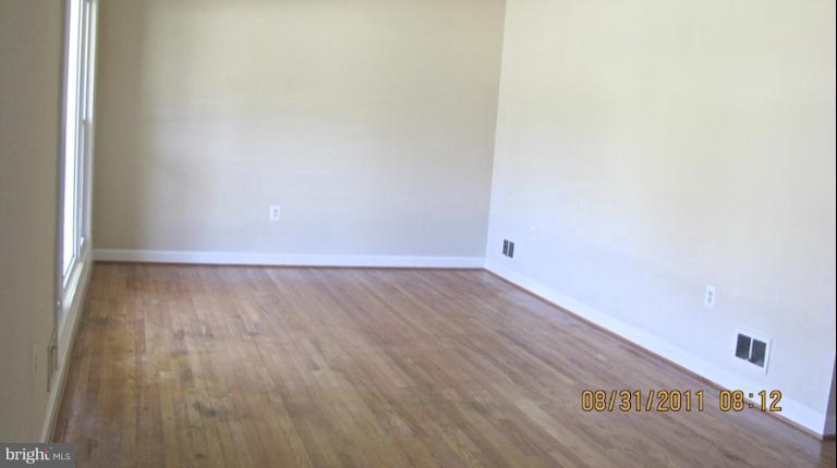 7116 Minna Road Gwynn Oak, MD 21207 - Photo 5 of 12 a view of a room with wooden floor