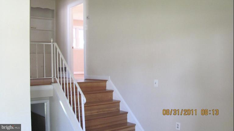 7116 Minna Road Gwynn Oak, MD 21207 - Photo 9 of 12 a view of entryway and hall with wooden floor