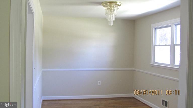 7116 Minna Road Gwynn Oak, MD 21207 - Photo 10 of 12 a view of a door in a room