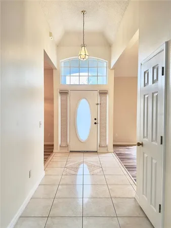 a view of a room with a tub and window