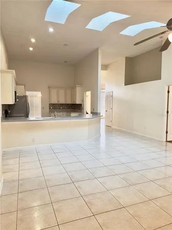 a view of a bathroom with a sink and a mirror