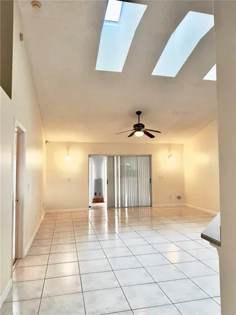 a view of a hallway with a chandelier