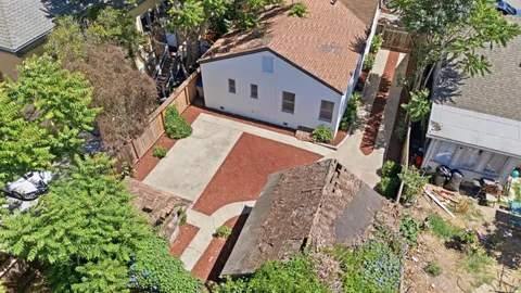 an aerial view of a house with garden