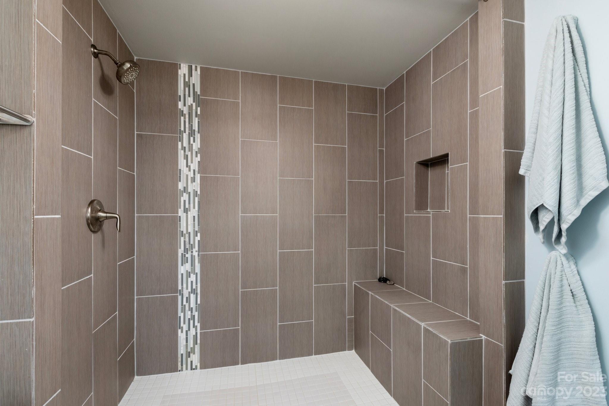 43 Kirkman Road Asheville, NC 28805 - Photo 22 of 27 a bathroom with a shower and a tub