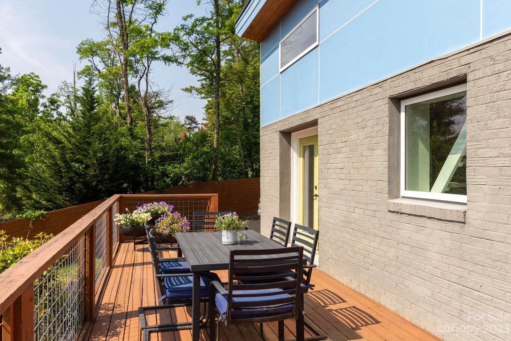 43 Kirkman Road Asheville, NC 28805 - Photo 25 of 27 a view of balcony with wooden floor and outdoor seating