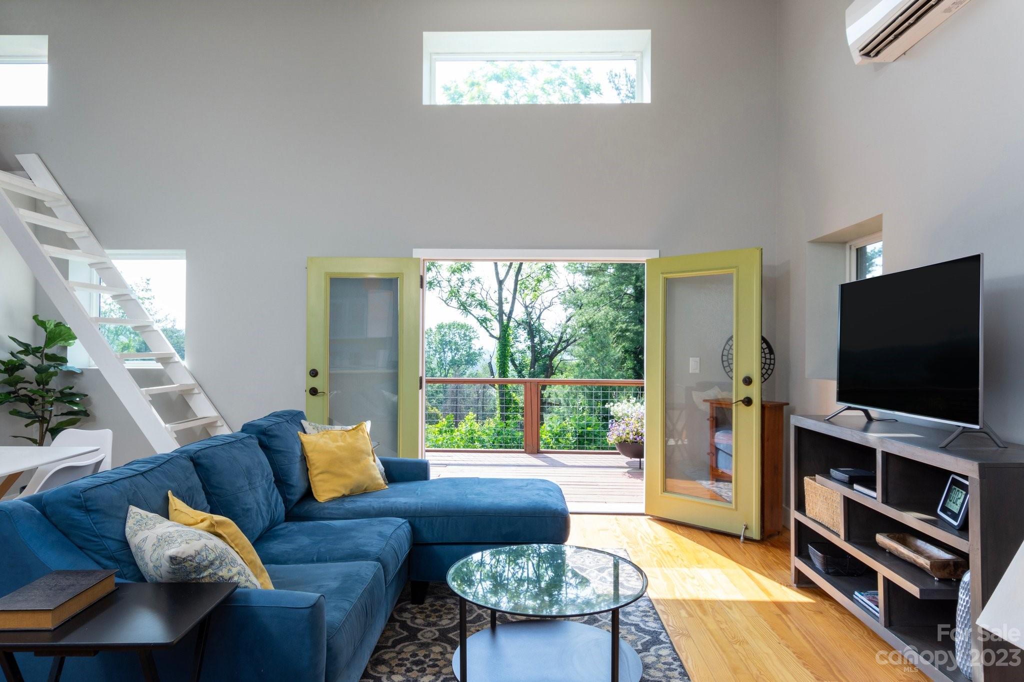 43 Kirkman Road Asheville, NC 28805 - Photo 4 of 27 a living room with furniture and a flat screen tv