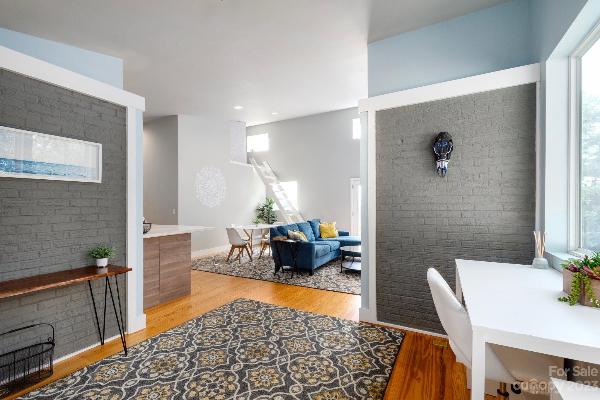 43 Kirkman Road Asheville, NC 28805 - Photo 6 of 27 a living room with furniture and wooden floor
