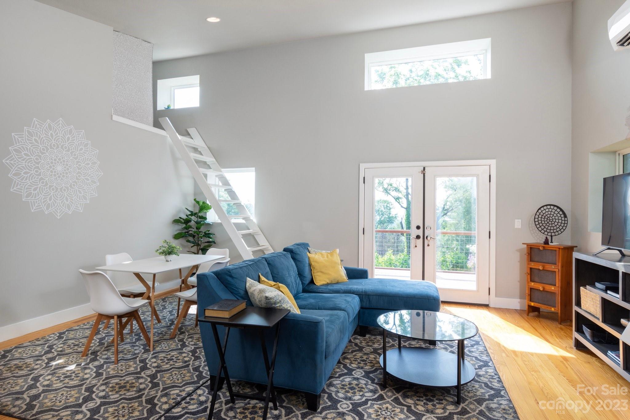 43 Kirkman Road Asheville, NC 28805 - Photo 7 of 27 a living room with furniture and a wooden floor