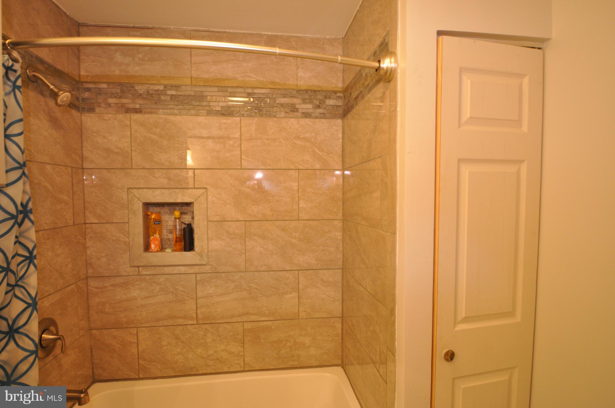 2597 Manchester Road Westminster, MD 21157 - Photo 10 of 14 CUSTOM TILE DESIGN IN BOTH BATHROOMS