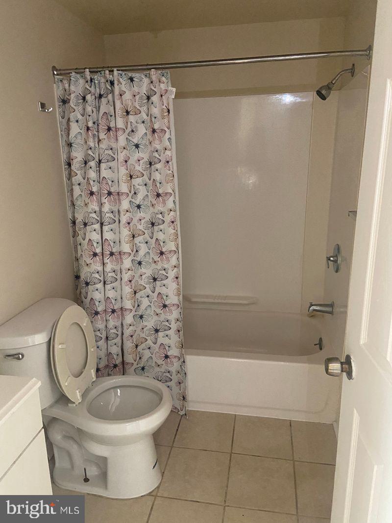 67 East Collom Street Philadelphia, PA 19144 - Photo 3 of 6 a bathroom with a granite countertop toilet a sink and a shower