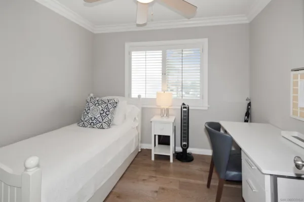 a bedroom with a bed and a table