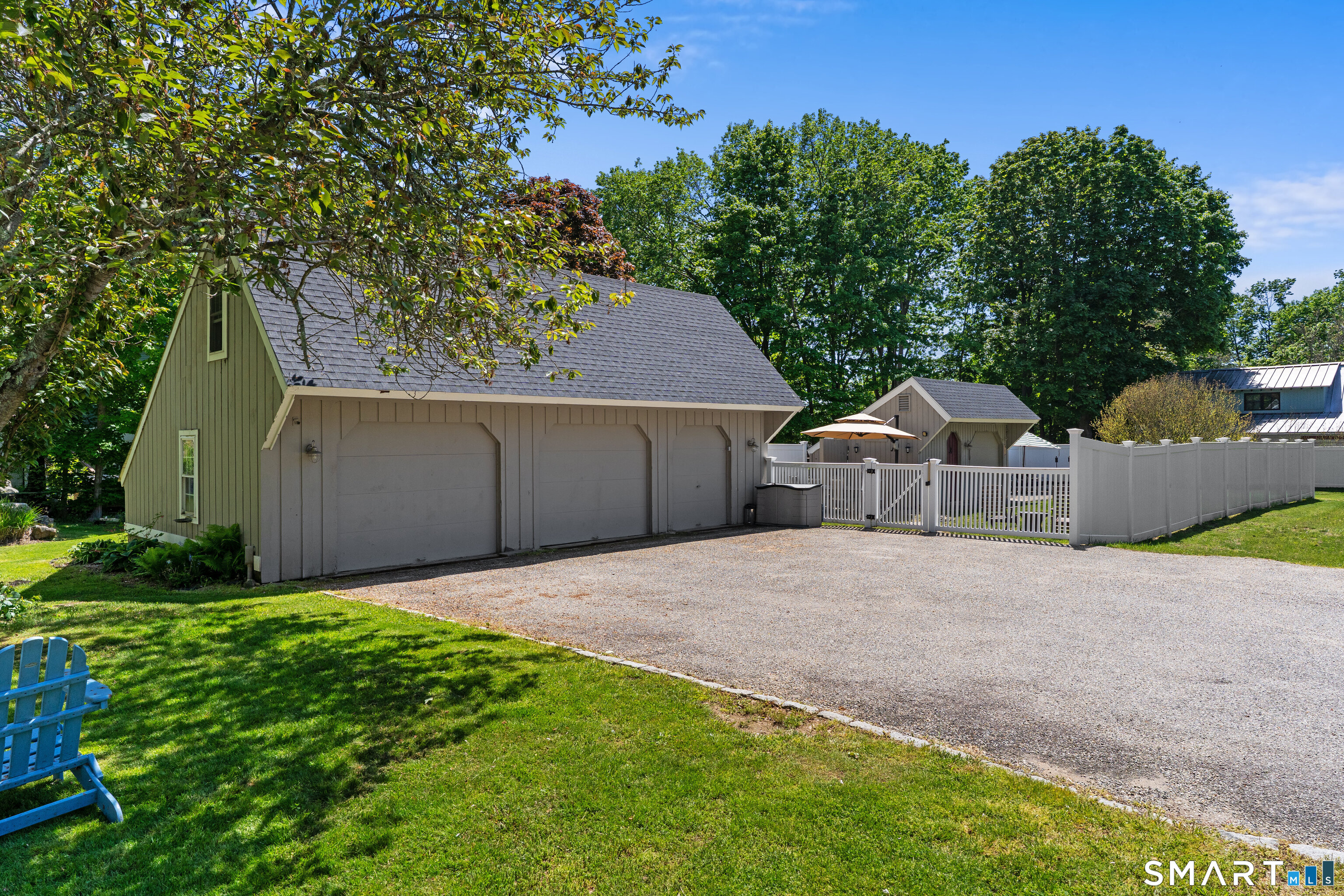 147 Boston Street Guilford, CT 06437 - Photo 6 of 38 a front view of a house with a yard and garage