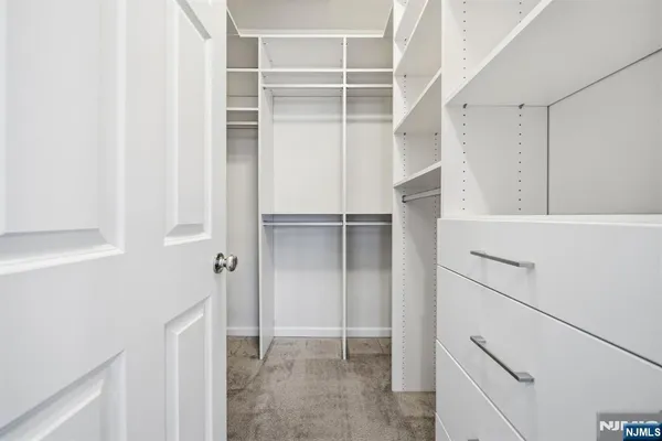 a view of an empty walk in closet