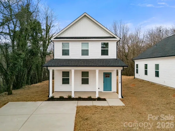 a front view of a house with yard