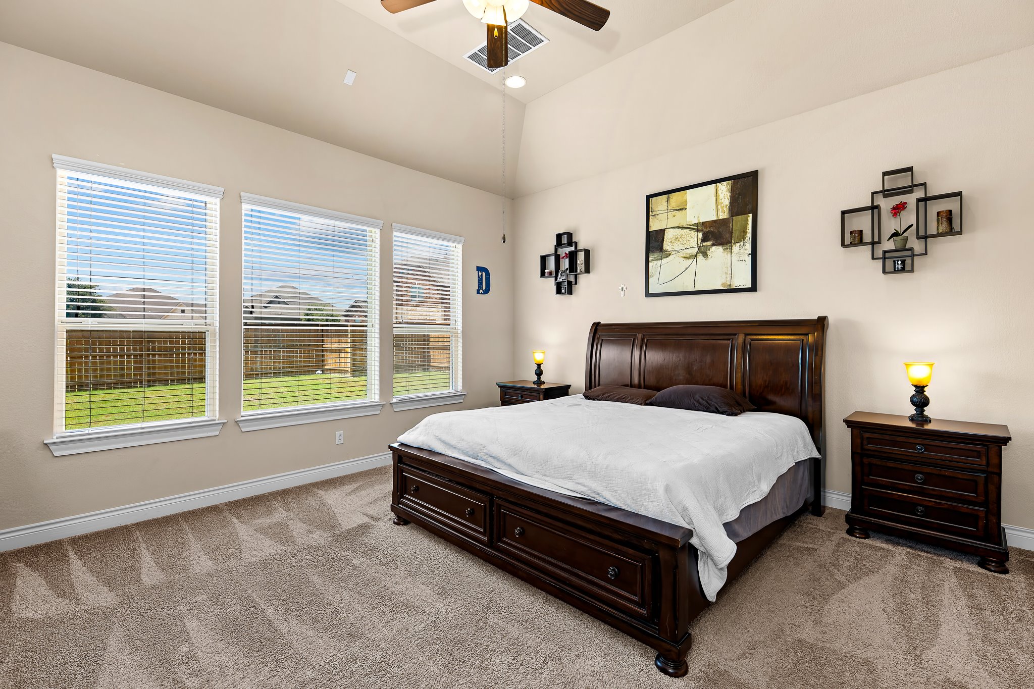 3501 Great Knot Pass Pflugerville, TX 78660 - Photo 16 of 40 a spacious bedroom with a bed and a chandelier