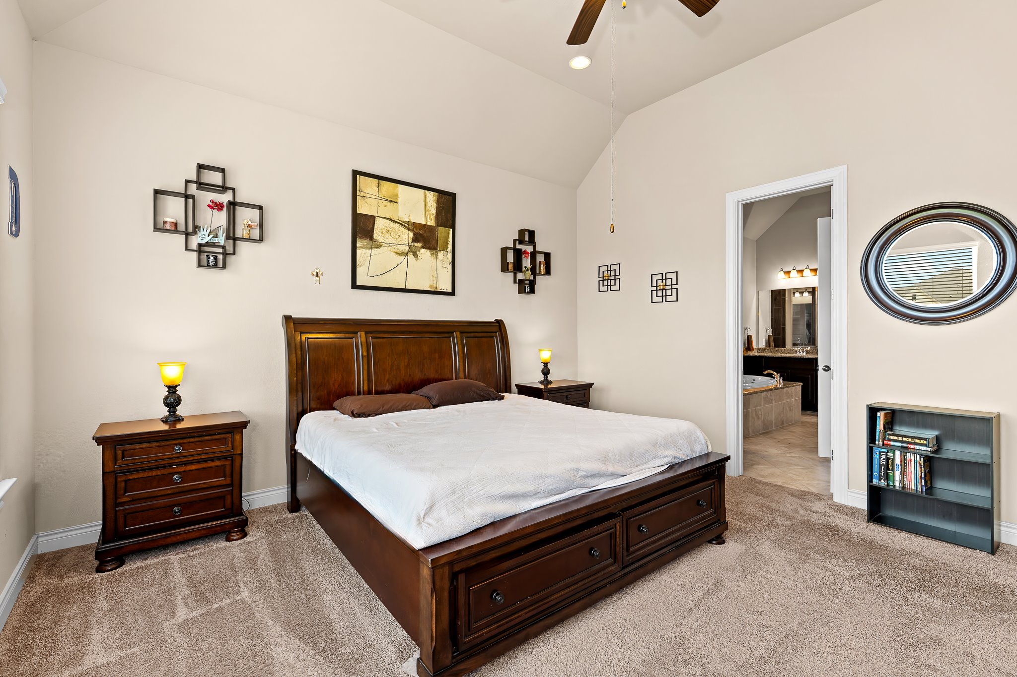 3501 Great Knot Pass Pflugerville, TX 78660 - Photo 17 of 40 a spacious bedroom with a bed and a chandelier