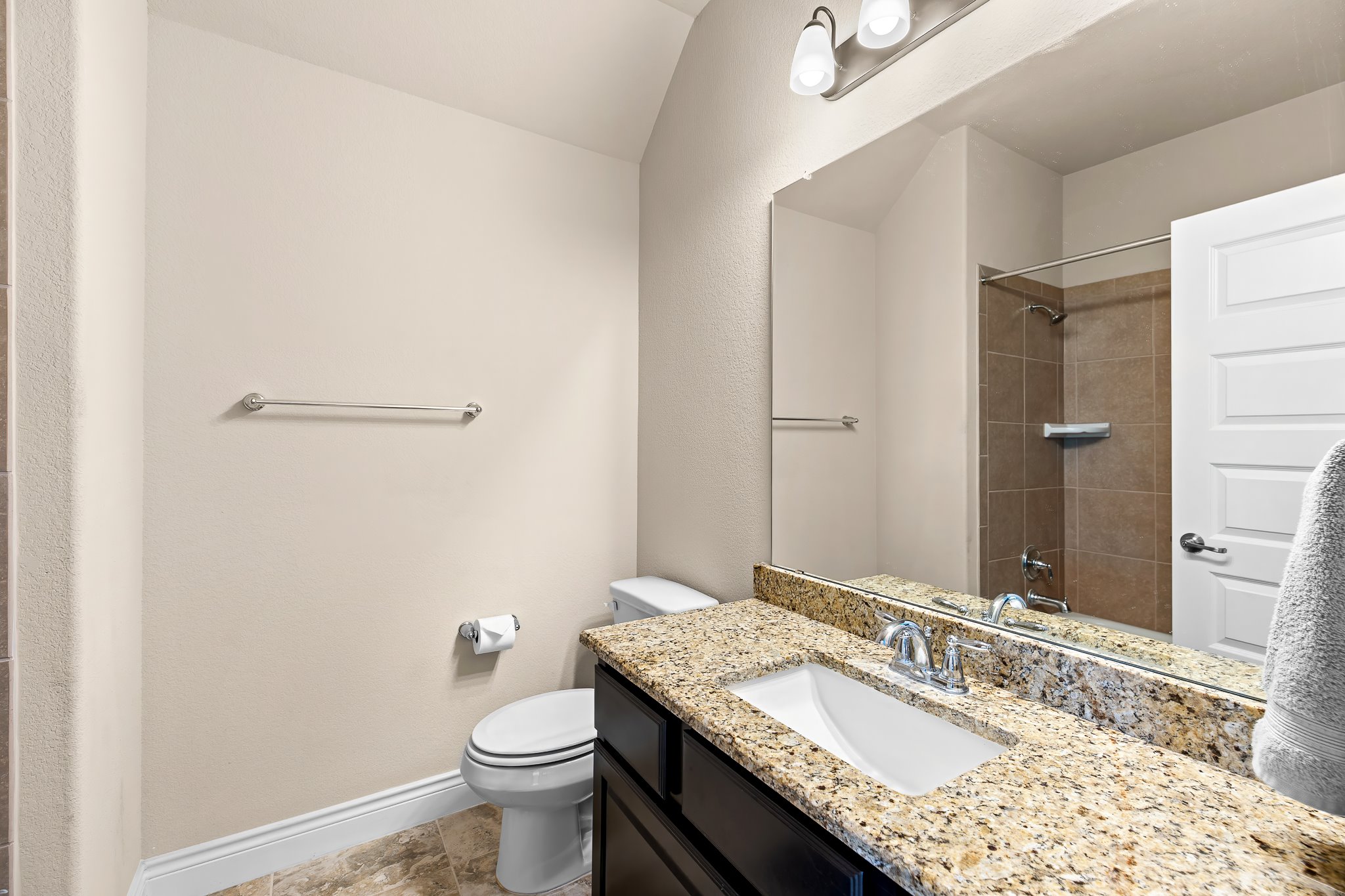 3501 Great Knot Pass Pflugerville, TX 78660 - Photo 28 of 40 a bathroom with a granite countertop sink a toilet and a mirror