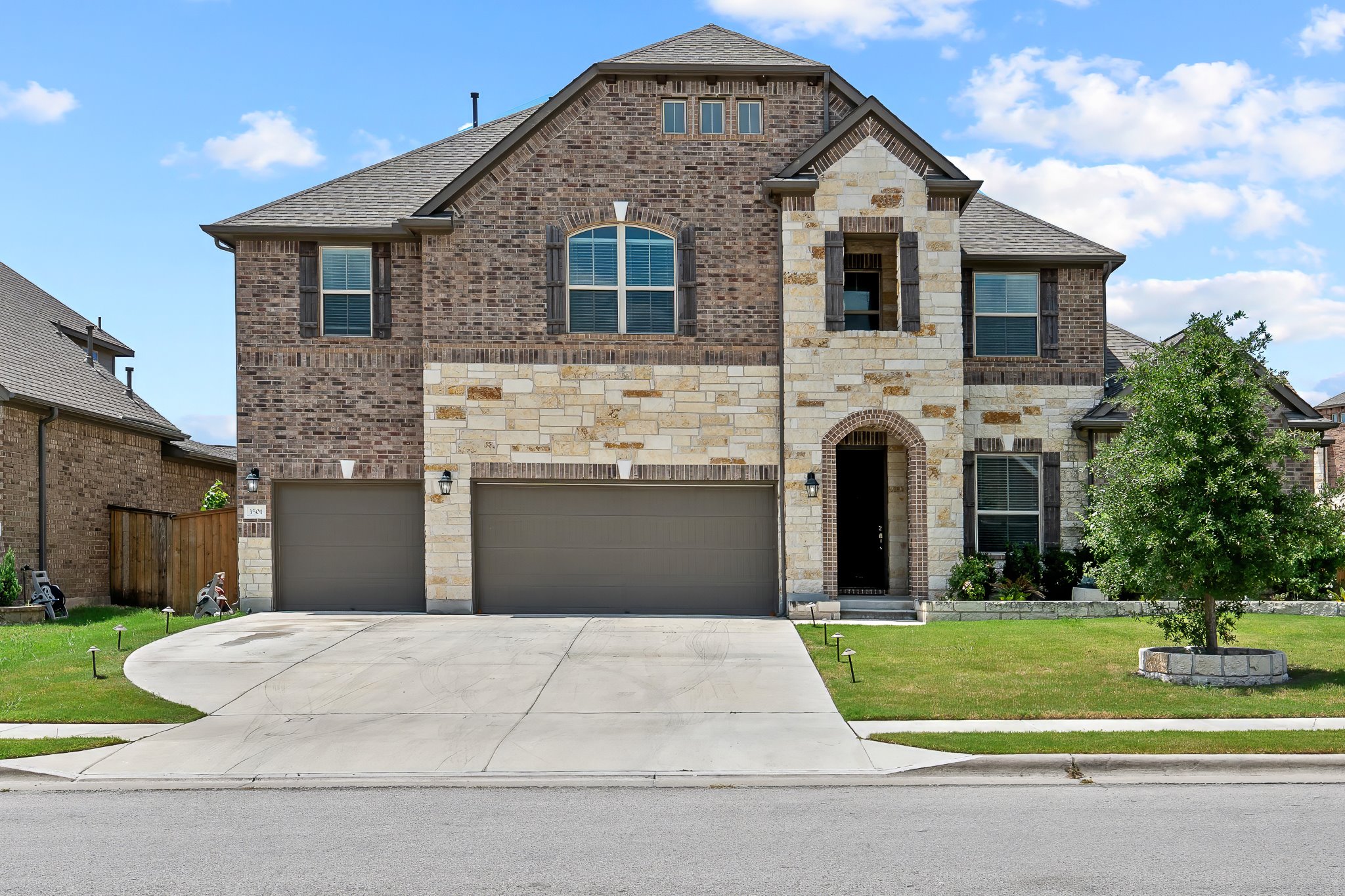 3501 Great Knot Pass Pflugerville, TX 78660 - Photo 3 of 40 a front view of a house with a yard
